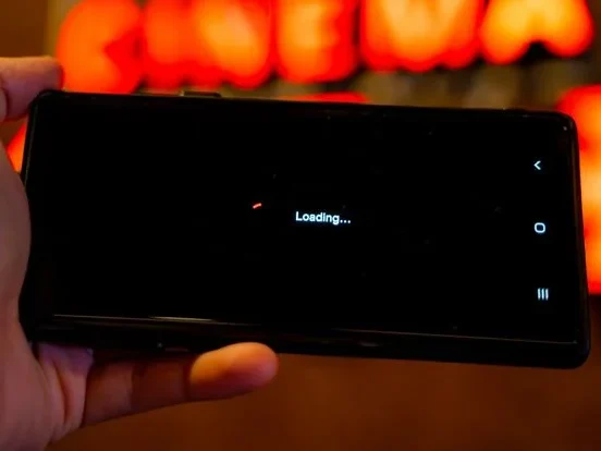 Phone screen showing a loading message