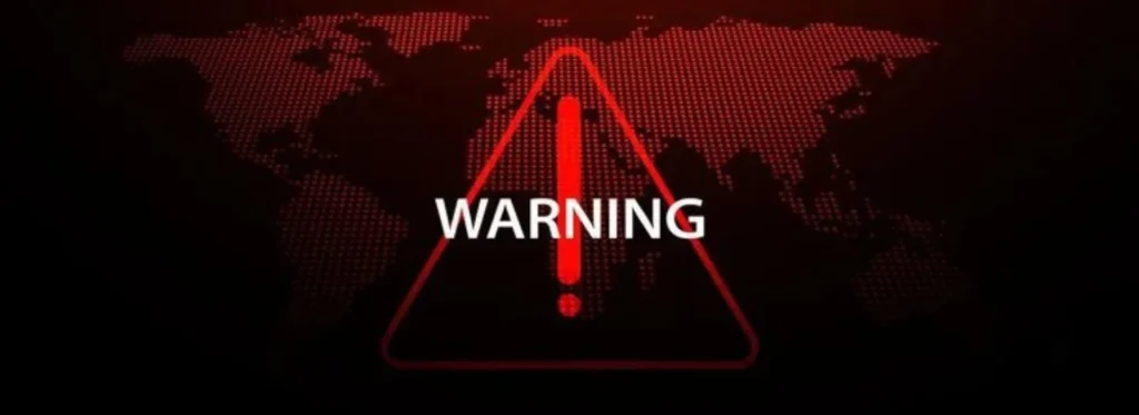 Red warning triangle over a dotted world map